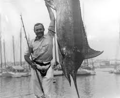 Ernest Hemingway posing with a marlin, Havana Harbor, Cuba. Credit Line: Ernest Hemingway Collection. John F. Kennedy Presidential Library and Museum, Boston.