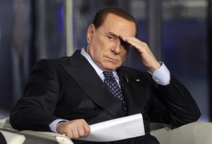 File photo shows Italy's former PM Berlusconi gesturing on a television show in Rome